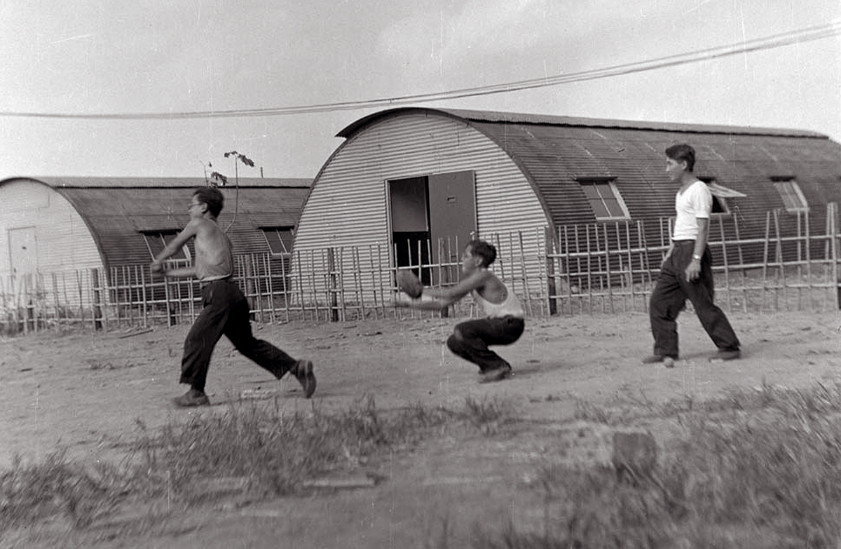 Bosch Town dormitory residents playing baseball